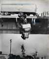 (LEAPERS AND JUMPERS) Contemporary binder containing 32 dramatic photographs of men and women jumping from high-rise buildings, bridges